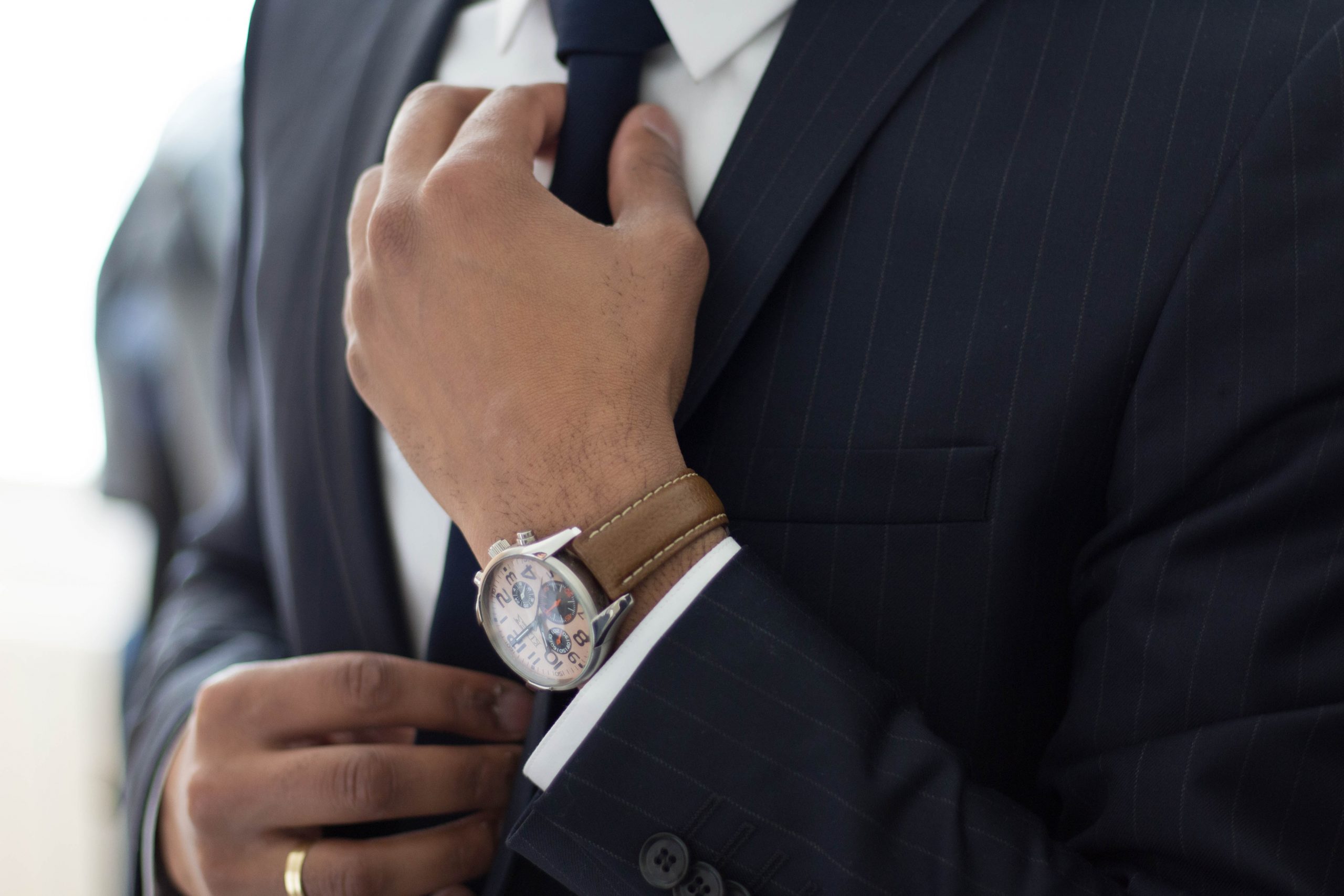employment attorney man wearing watch with black suit