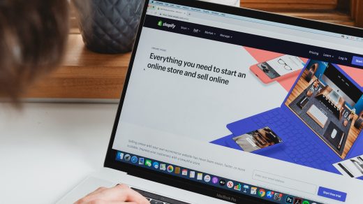 start an online store person using macbook pro on white table