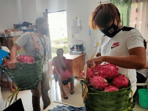 A buyer picks up his orders from Nanay Teting.