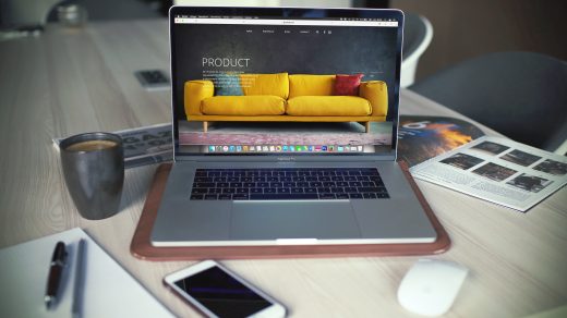 ecommerce marketing turned on MacBook Pro beside gray mug