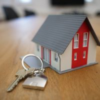 online business directory white and red wooden house miniature on brown table
