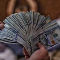financial tips 100 US dollar banknotes