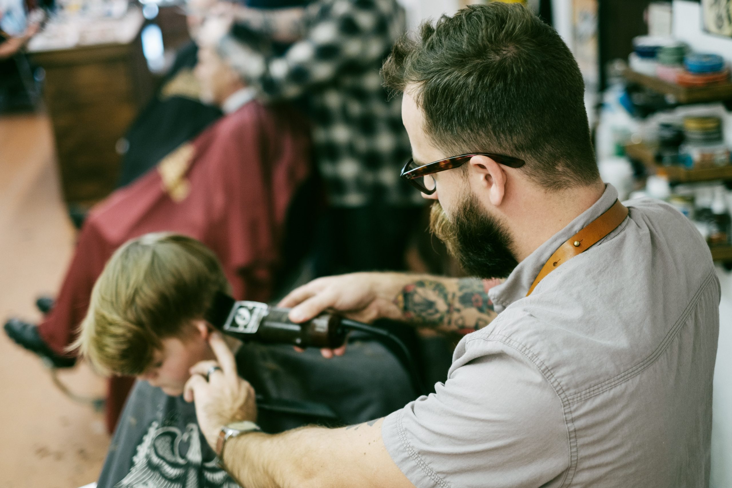 salon marketing ideas man shaving the boy's hair