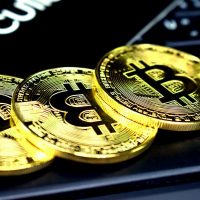 crypto libra three round gold-colored bitcoins