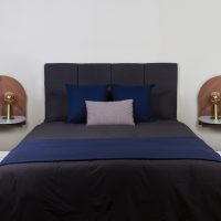 bed frame blue bed linen with pillows