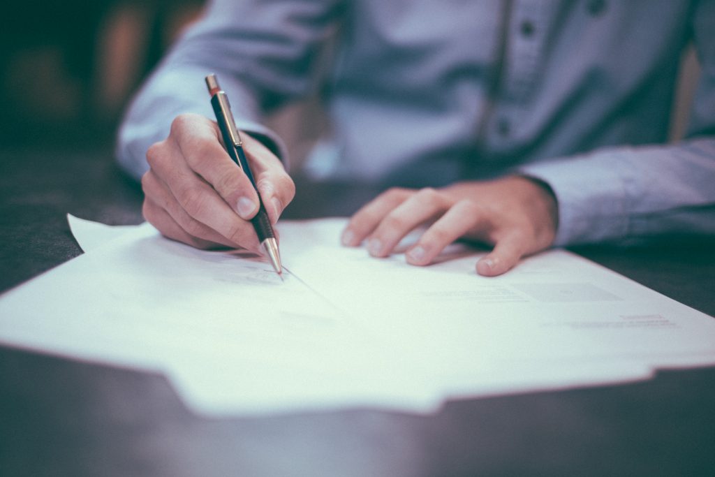 8 Things You Should Include In Your Resume 1 resume man writing on paper