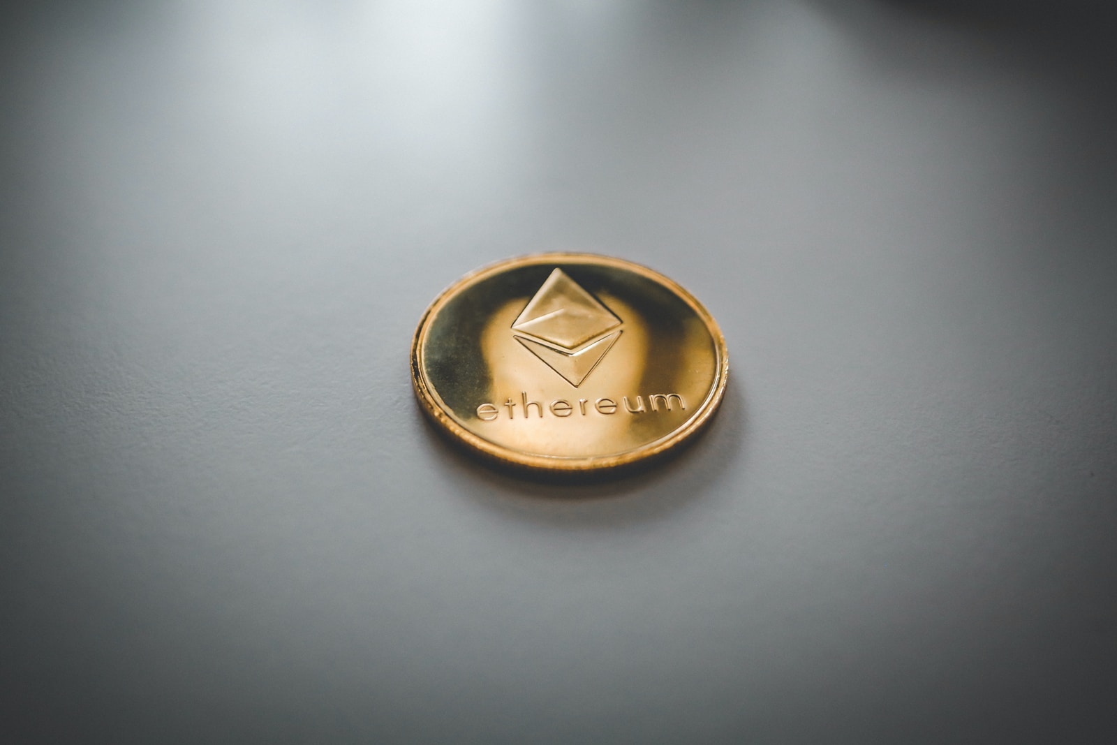 ethereum gold and black round emblem
