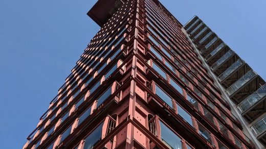 steel building low angle photography of pink high-rise building