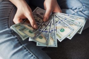 Hard Money Loans fan of 100 U.S. dollar banknotes
