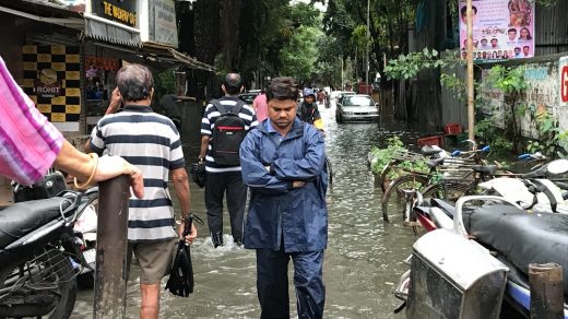 Disaster Preparedness people walking on flooded streets during day
