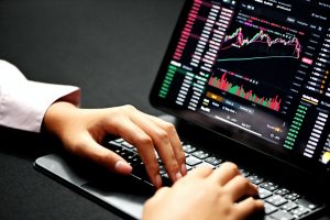 price action trading person using black laptop computer