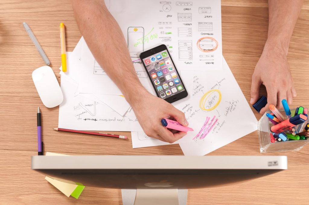 8 Marketing Strategies for Digital Growth (2021 & So-on) 1 person writing on white paper