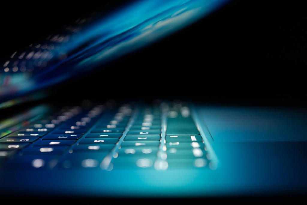 Website Security closeup photo of turned-on blue and white laptop computer