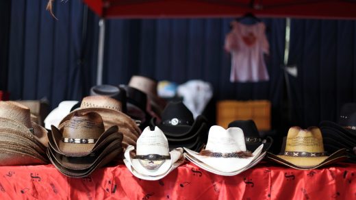 assorted-color cowboy hats on table