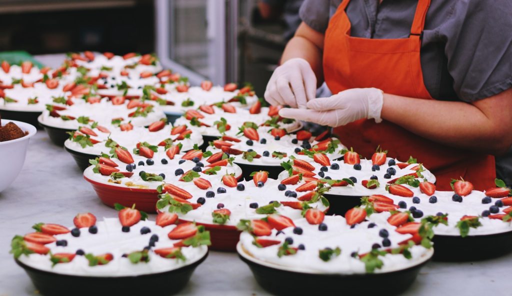 Making Food Your Business 4 person decorating dishes on table