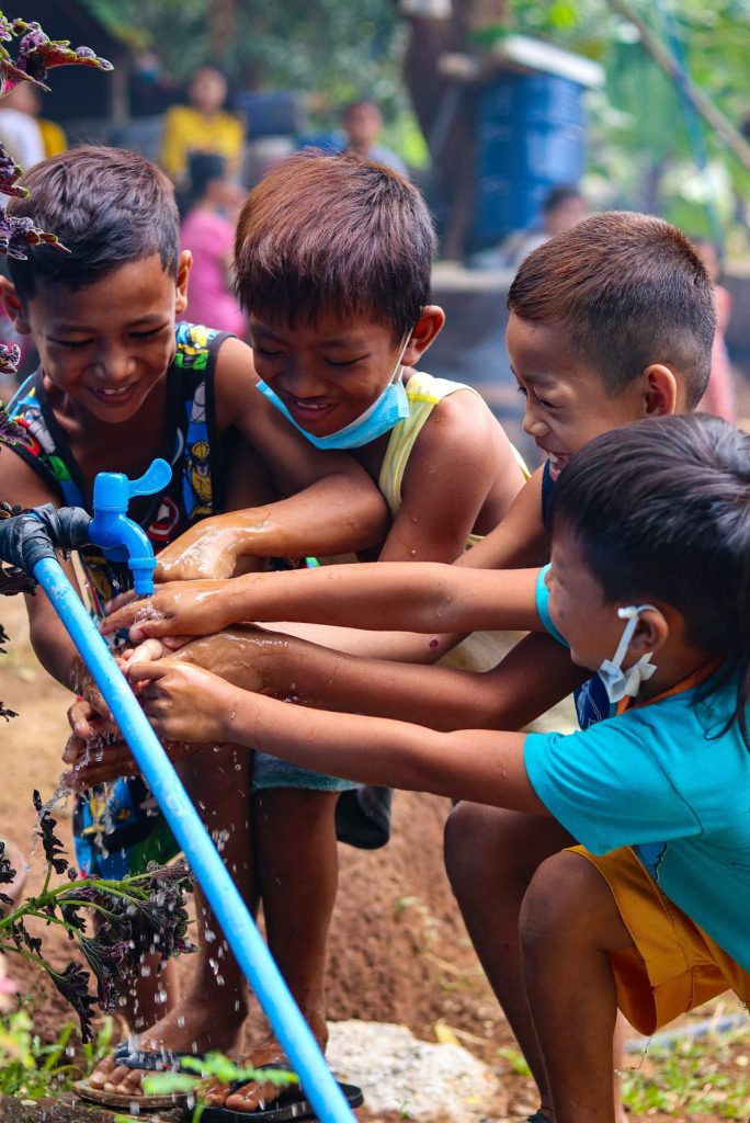 Children from the GK ICD Village in Bagac Bataan enjoy their new water source.
