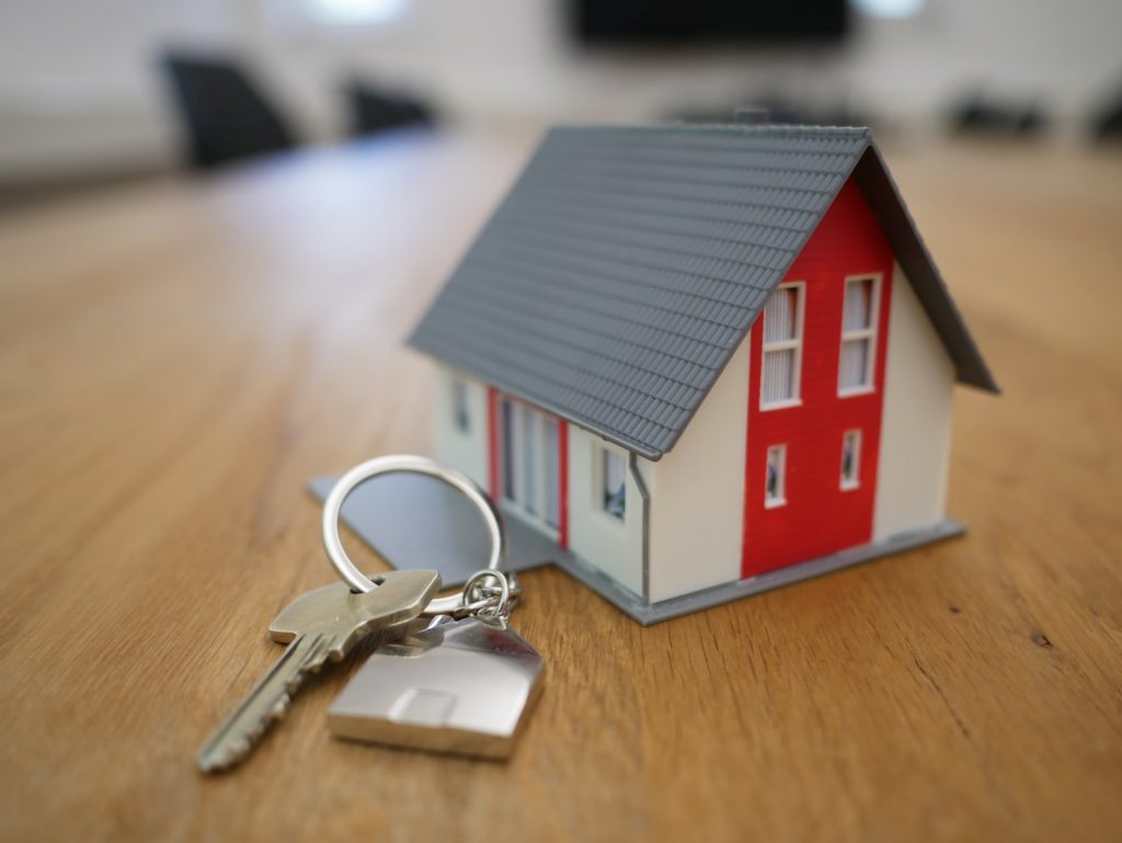The Important Aspects You Need to Consider for Effective Property Management 1 white and red wooden house miniature on brown table