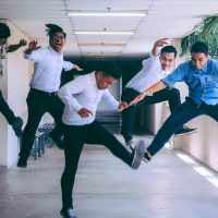 group of people doing jump shot photography
