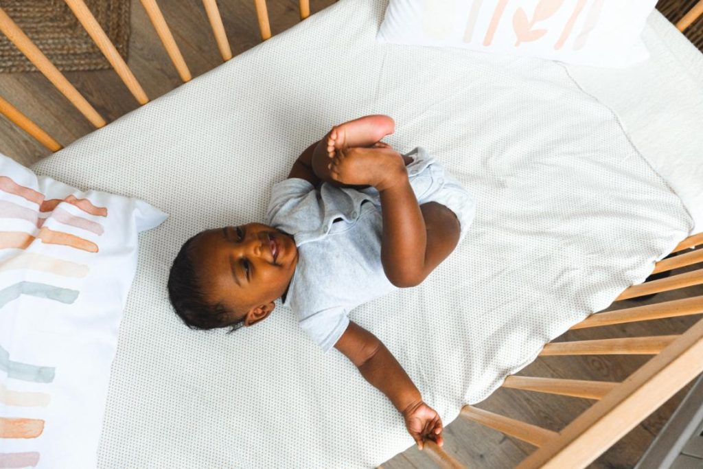 A baby in a crib.