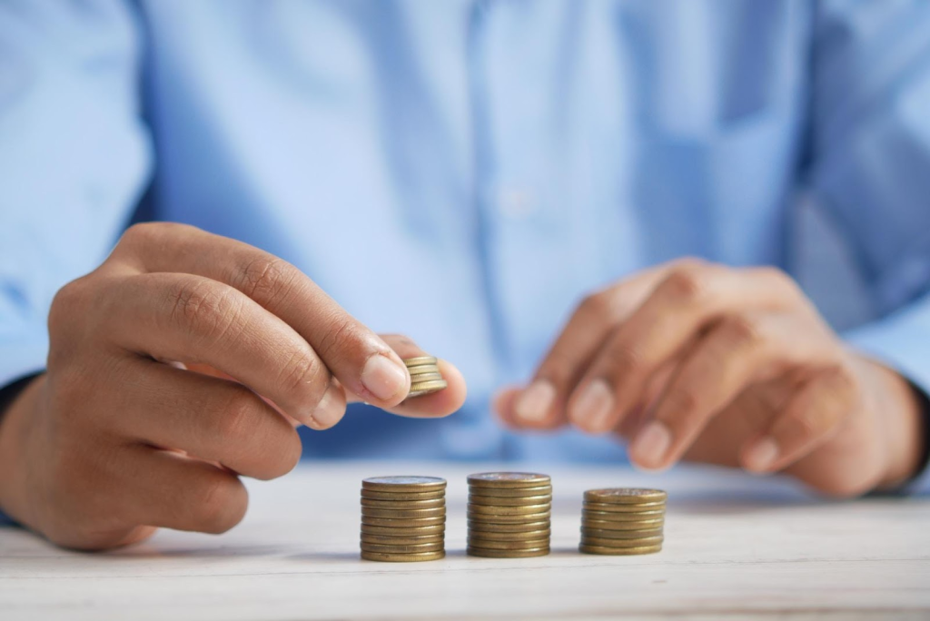 A man counting coins.