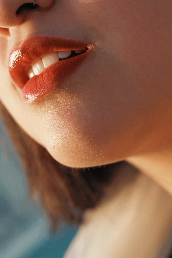 Understanding the Causes and Treatment Options for Lip Lines and Lip Wrinkles 1 woman wearing red lipstick