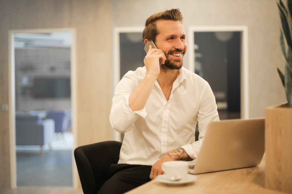 Mastering the Art of Entrepreneurship: 7 Key Lessons 1 man using smartphone on chair