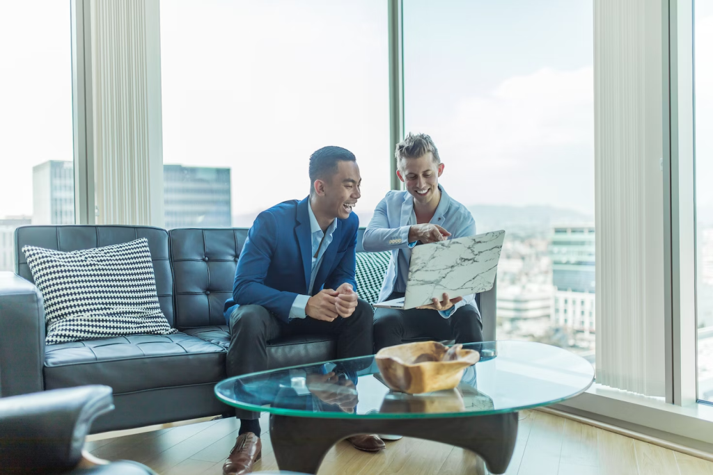 Why Businesses Benefit from Professional Inspection Services 2 two guys sitting with a laptop