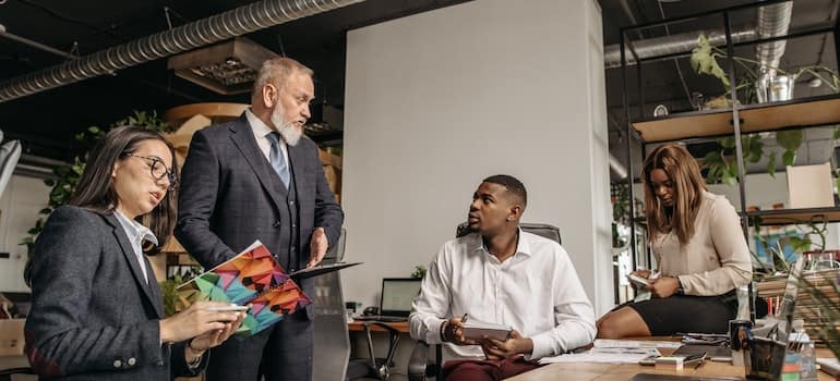 A team of workers at a business meeting in an office