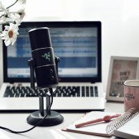 black microphone on white paper