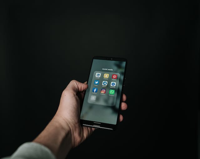 Why Small Businesses Should Automate Their Social Media 1 Cellphone- Automate Their Social Media