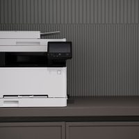 a white and black printer sitting on top of a counter