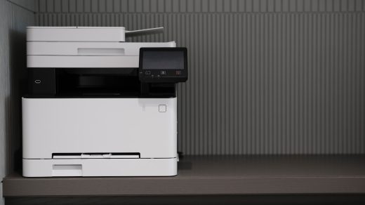 a white and black printer sitting on top of a counter
