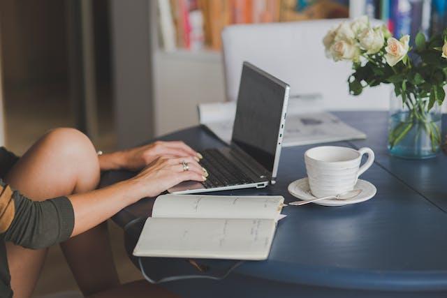 A person working on their laptop.