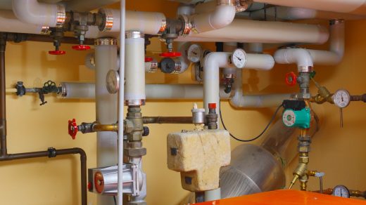 pipes and valves in a room with orange table