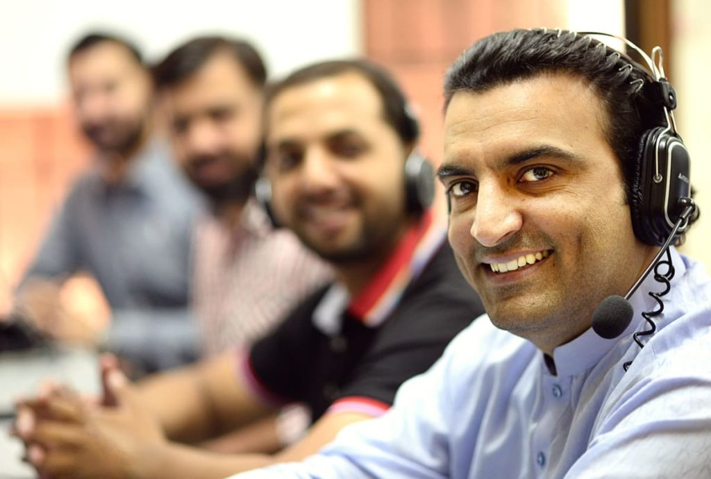 Why Your Business Needs a Call Center? 2 man in white button up shirt smiling