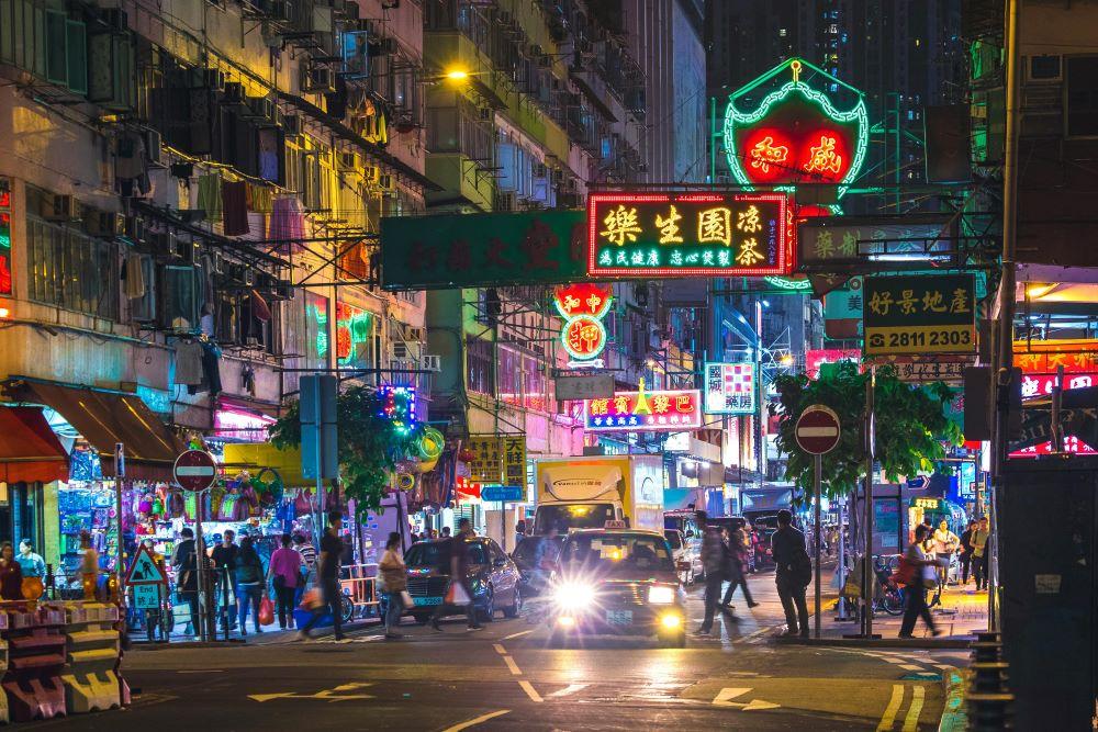 A busy street in Hong Kong at night