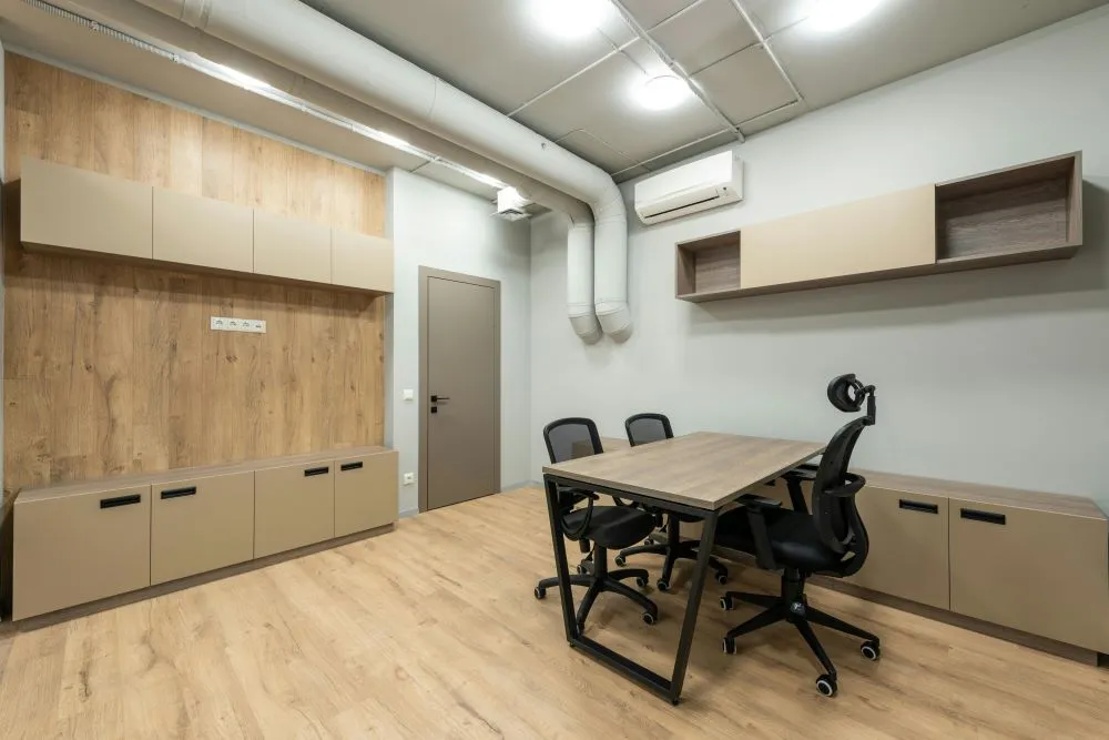 Shared Spaces, Shared Air: Why Multi-Tenant Businesses Must Prioritize Air Duct Cleaning 2 A ventilation system with an air conditioner.