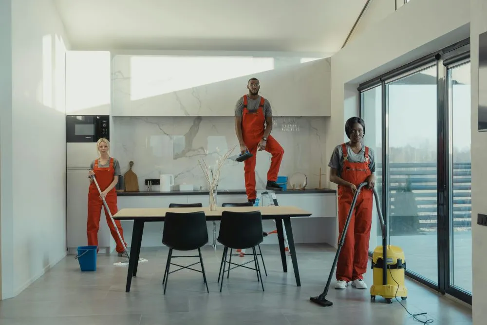Shared Spaces, Shared Air: Why Multi-Tenant Businesses Must Prioritize Air Duct Cleaning 3 Cleaners getting ready to clean a home.