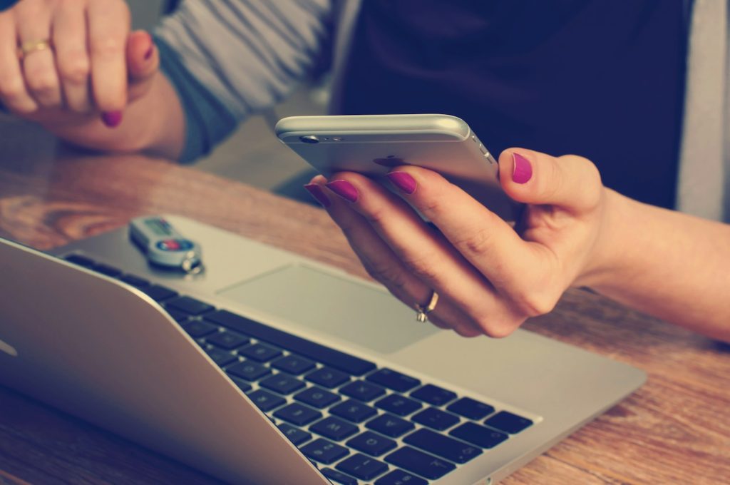 The Benefits and Drawbacks of Mobile Printers 1 woman holding silver iPhone 6