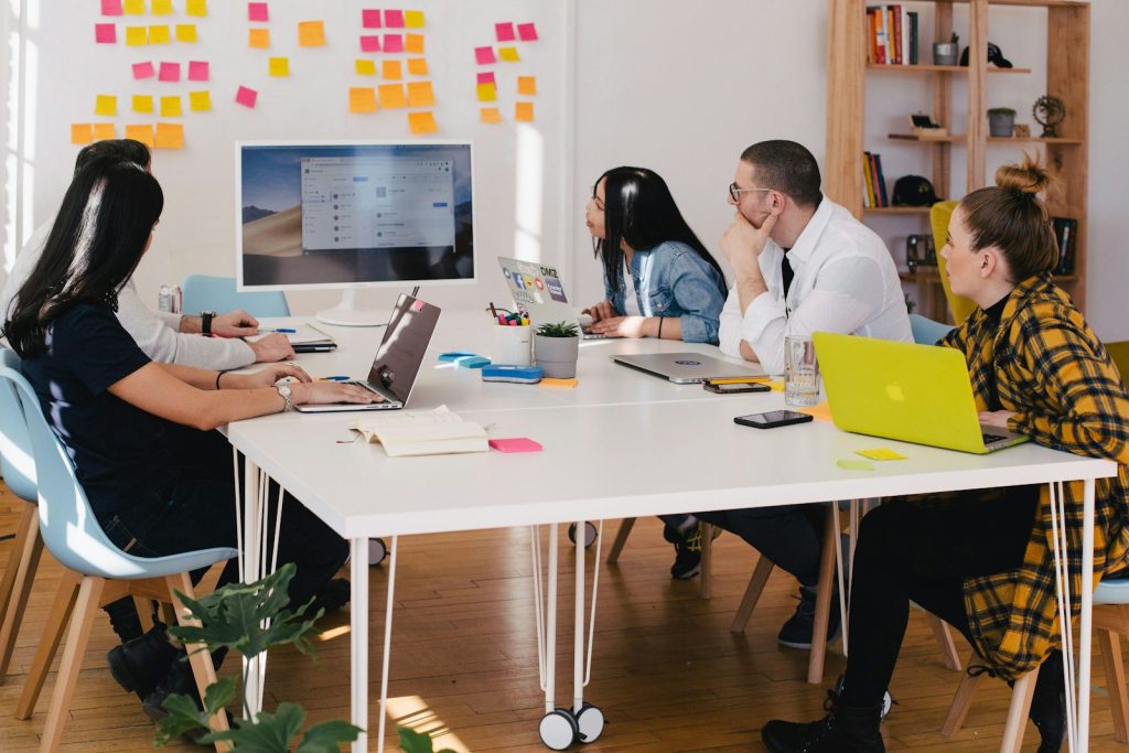 7 Essential Tips for Writing a Business Plan 1 five person by table watching turned on white iMac