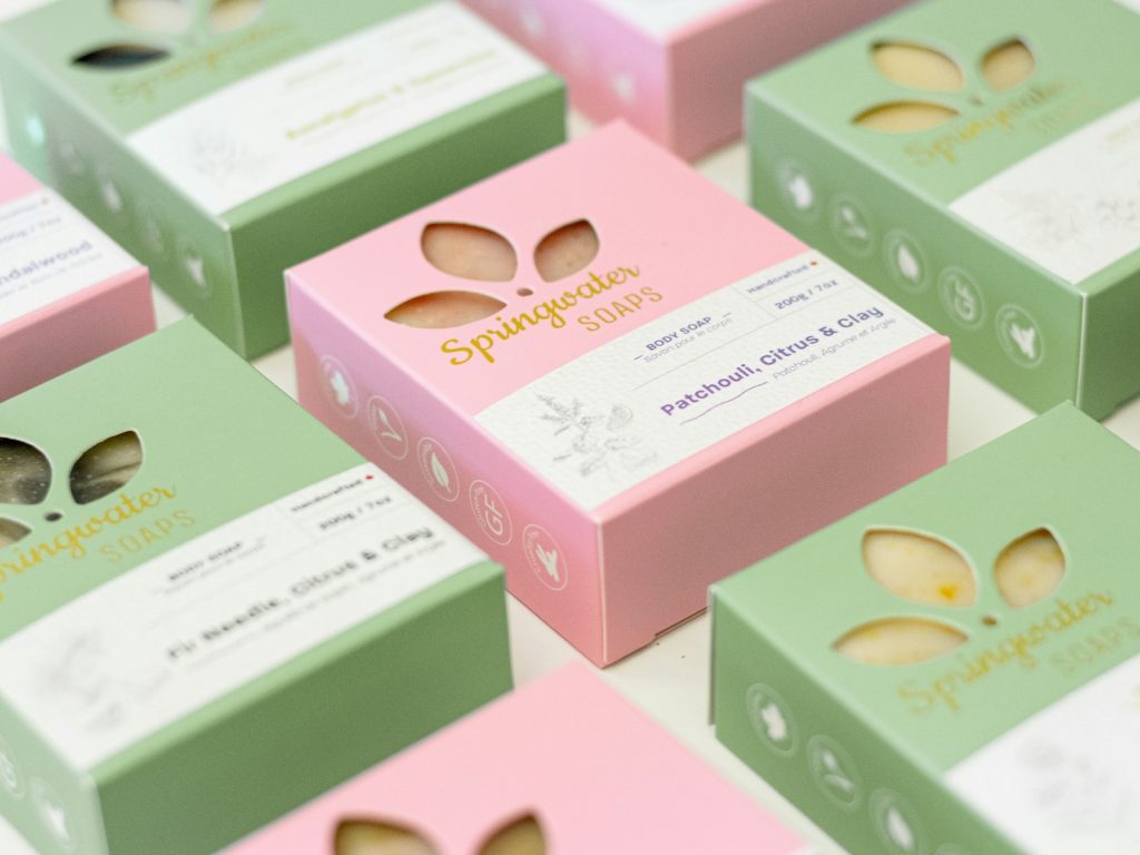 The Power of Cosmetic Packaging: How to Design Labels That Sell 1 green and pink cardboard boxes