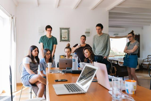 people looking at a laptop