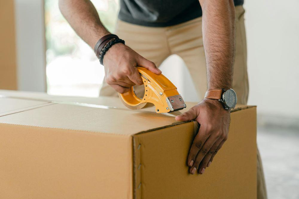 A man packing a box