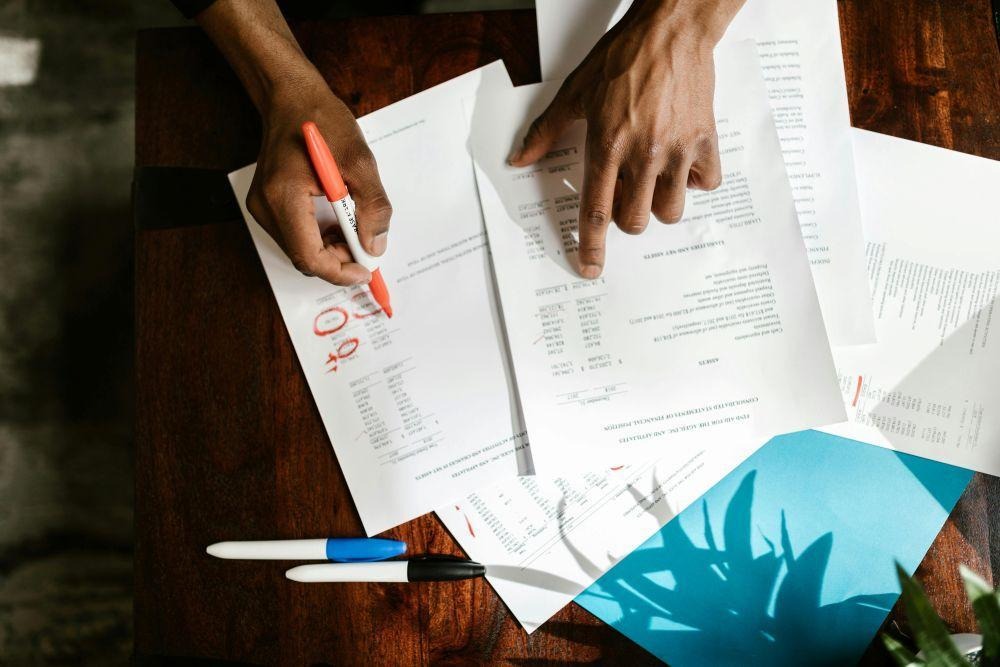 How to Time an Office Move in Ohio Around Seasonal Business Cycles (And Why It Matters) 2 A man circling words on a paper