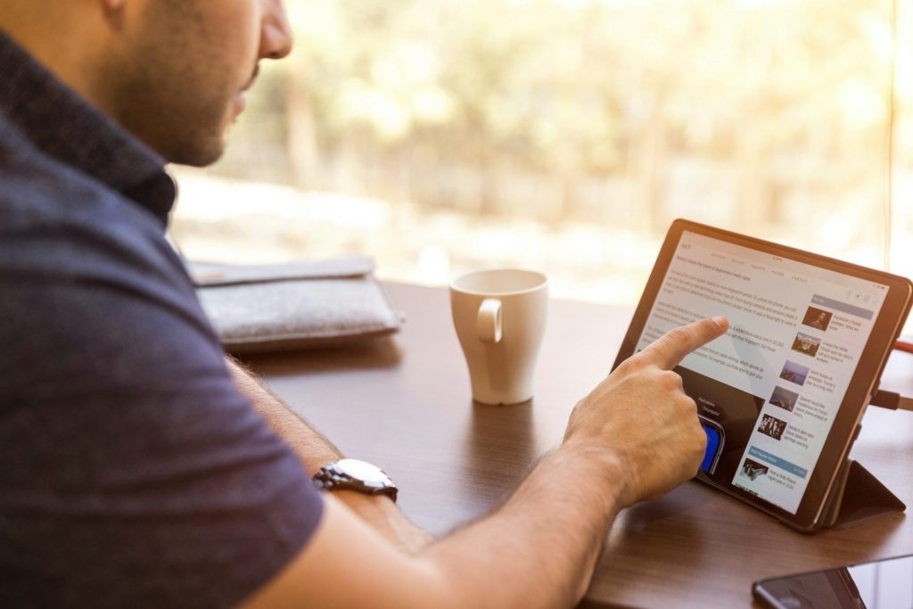 How Recruiters Use LinkedIn Scraping to Find Better Candidates 3 man holding tablet computer