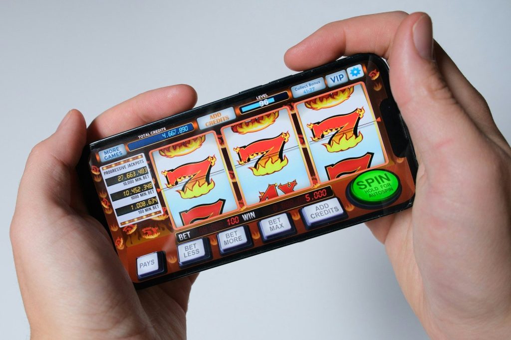 Discover the Thrill of GGBet Online Casino: Your Ultimate Gaming Destination 1 Someone is playing a mobile slot machine game.