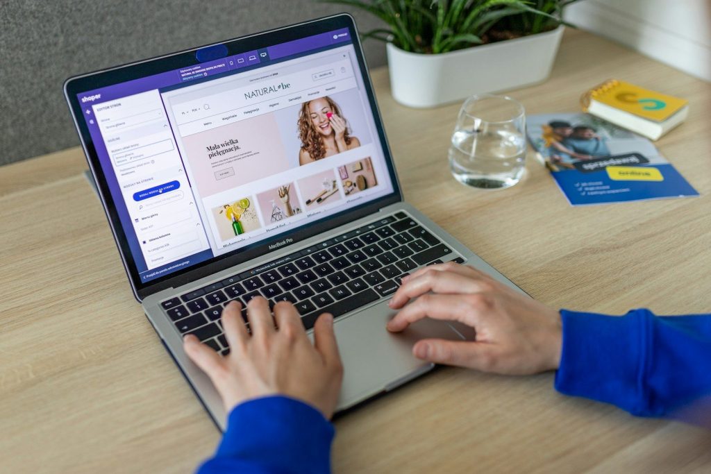 How Technology is Changing E-commerce 1 a person typing on a laptop on a table