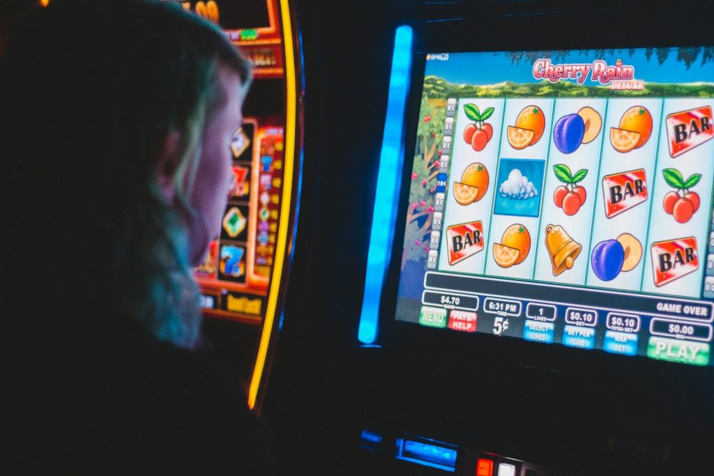 Top Gambling Sites in 2022 You Definitely Need to Visit 1 man playing slot machine game