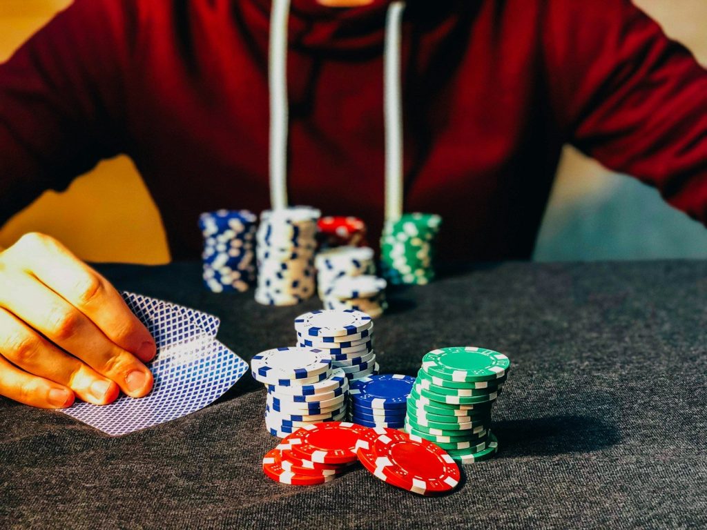 Make Every Bet Count: Expert Tips for Maximizing Your Online Gambling Wins 3 person sitting near poker chips